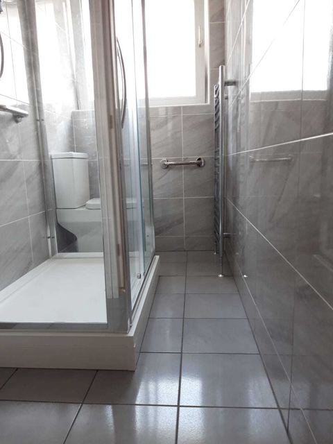 A bathroom installation in an unusually shaped room — finished