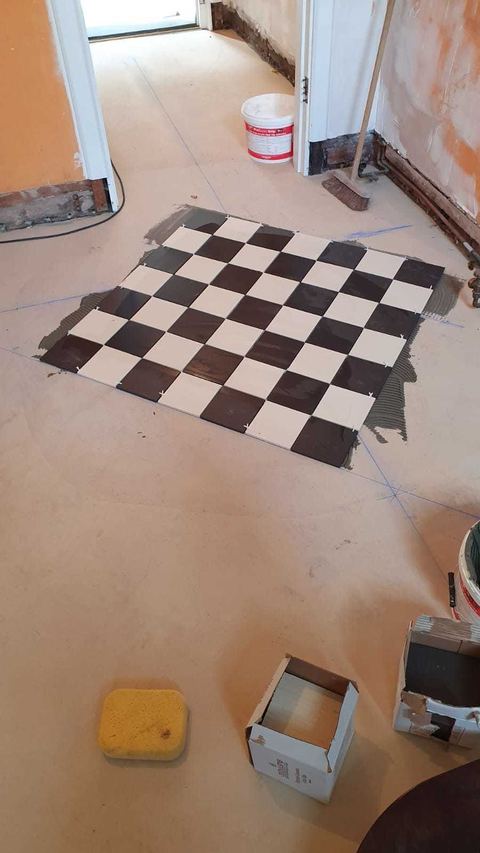 Victorian-style floor tiling laid on the diagonal — finished