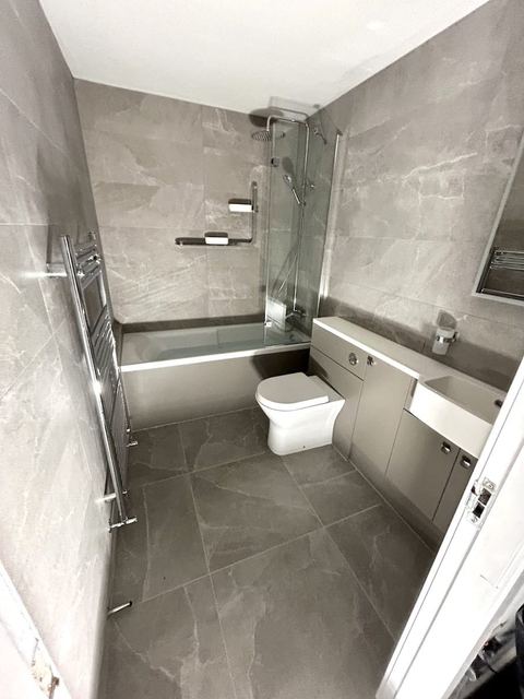 Repositioned bath to open up a compact bathroom — finished