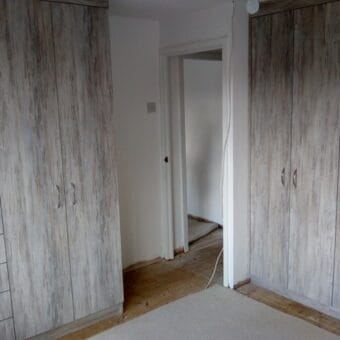 Bespoke fitted bedroom in Dark Artwood — finished