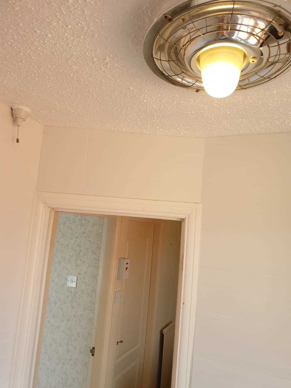 White ceramic tiling to lift a small bathroom — finished