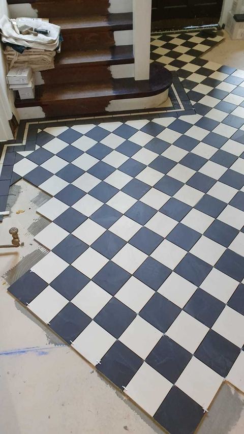 Victorian-style floor tiling laid on the diagonal — finished