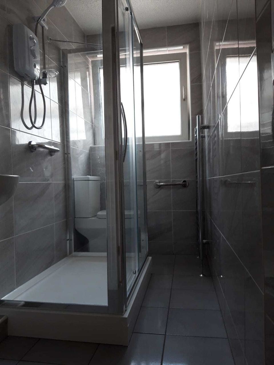 A bathroom installation in an unusually shaped room — finished