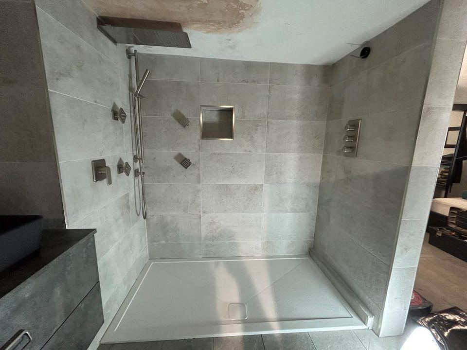 Contemporary apartment bathroom with spa-style storage — finished