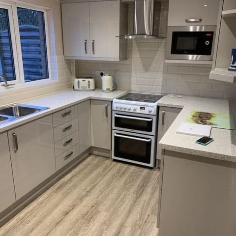 Cashmere Gloss kitchen with integrated storage — finished