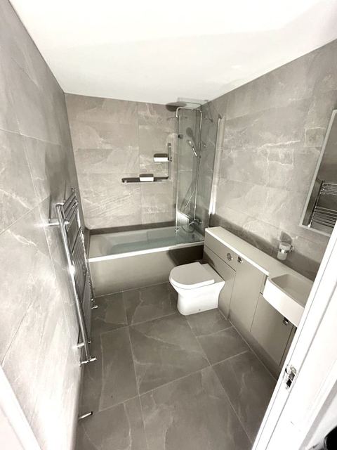 Repositioned bath to open up a compact bathroom — finished