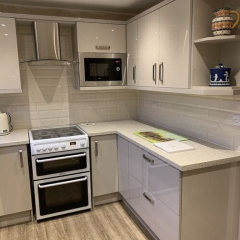 Cashmere Gloss kitchen with integrated storage — finished