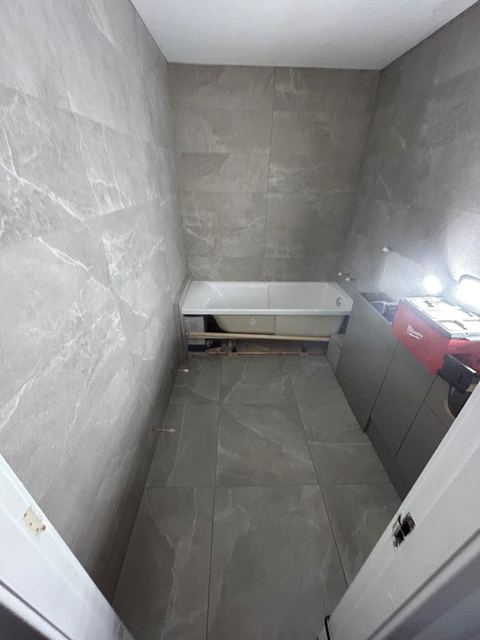 Repositioned bath to open up a compact bathroom — finished