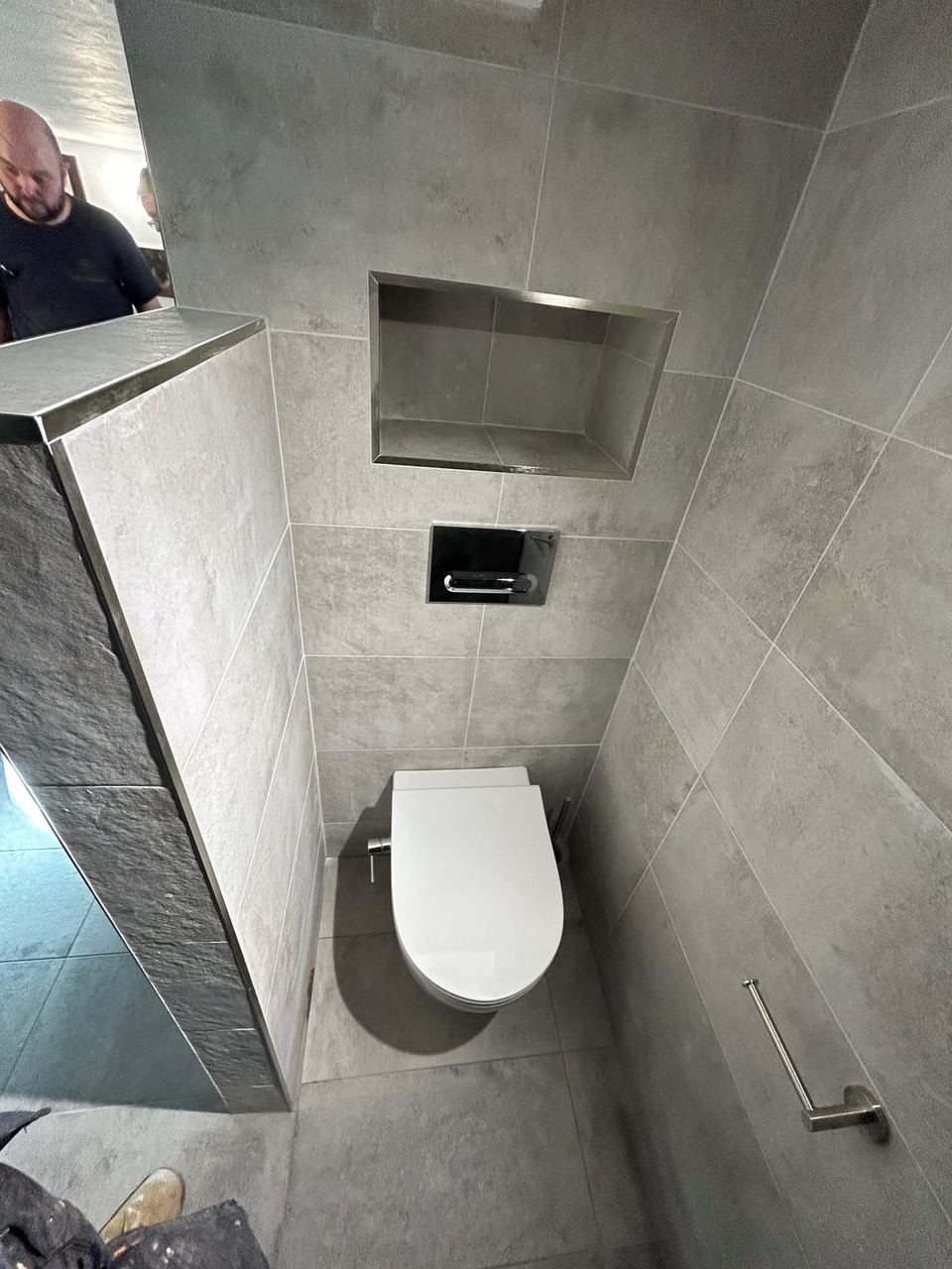 Contemporary apartment bathroom with spa-style storage — finished