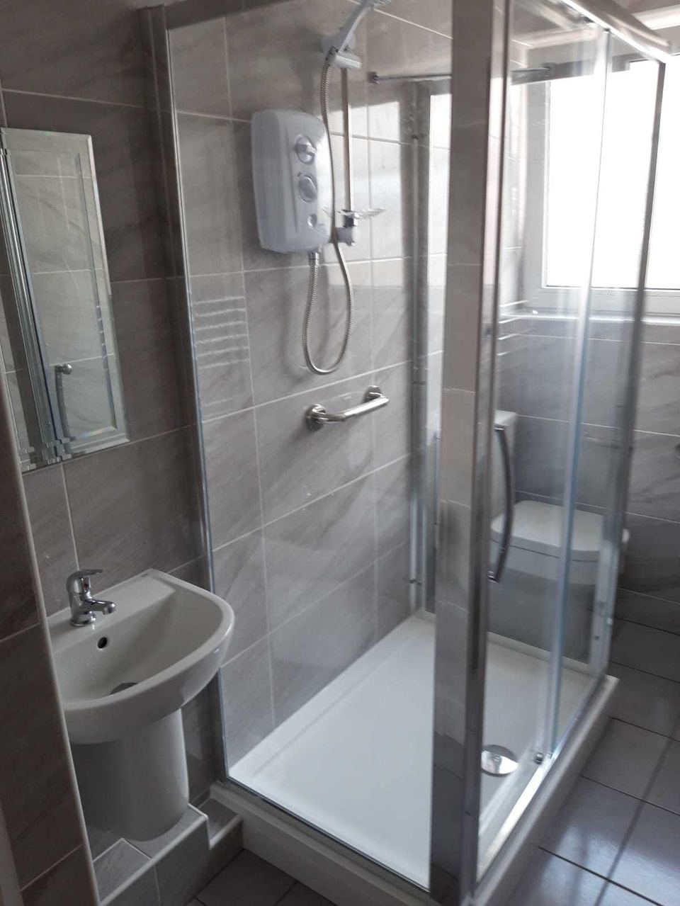 A bathroom installation in an unusually shaped room — finished