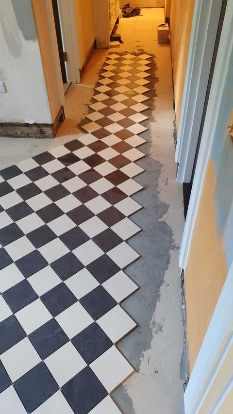 Victorian-style floor tiling laid on the diagonal — finished