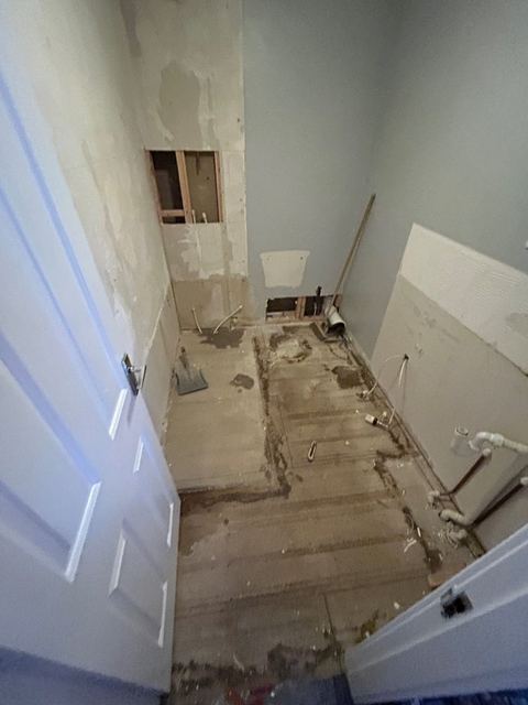 Repositioned bath to open up a compact bathroom — finished