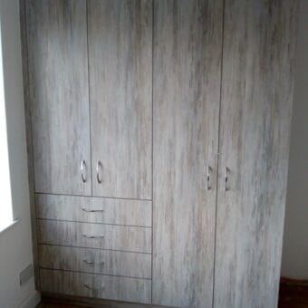 Bespoke fitted bedroom in Dark Artwood — finished