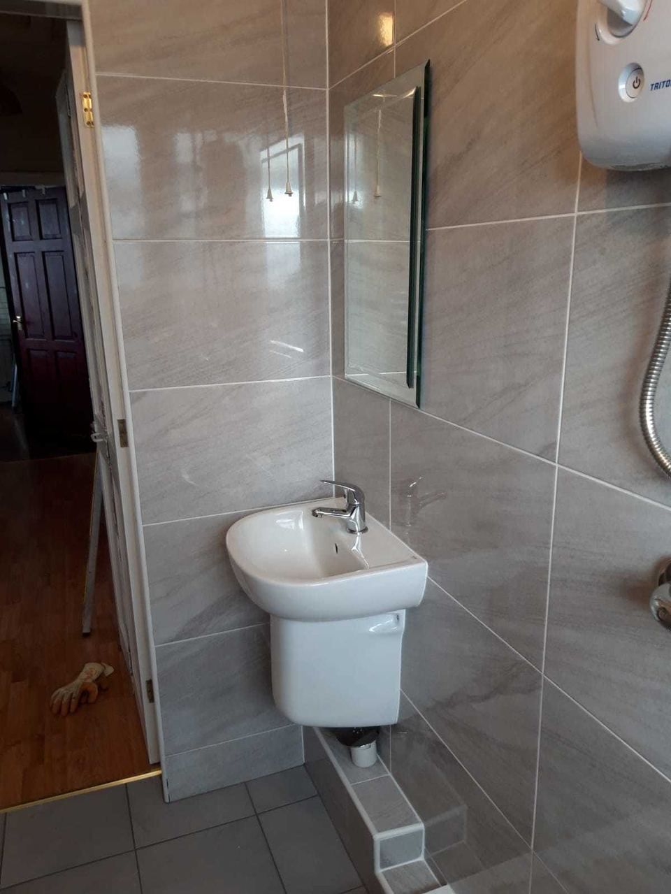 A bathroom installation in an unusually shaped room — finished