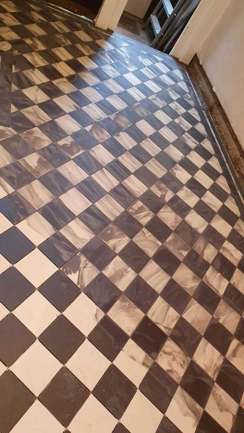 Victorian-style floor tiling laid on the diagonal — finished