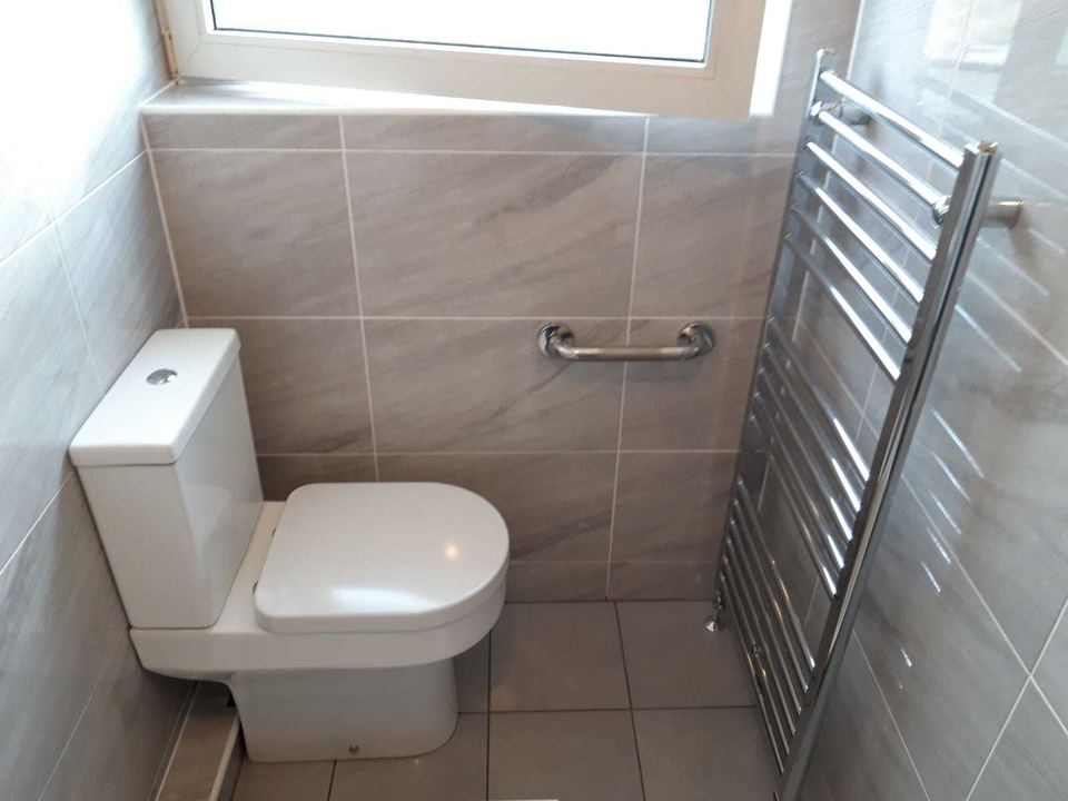 A bathroom installation in an unusually shaped room — finished
