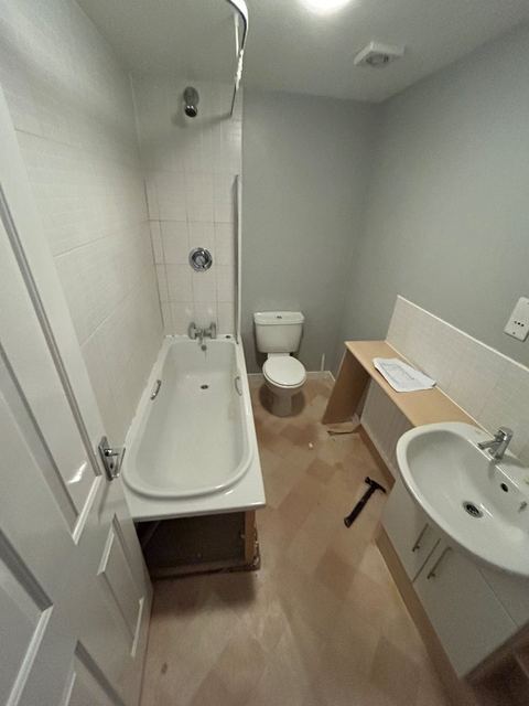 Repositioned bath to open up a compact bathroom — finished