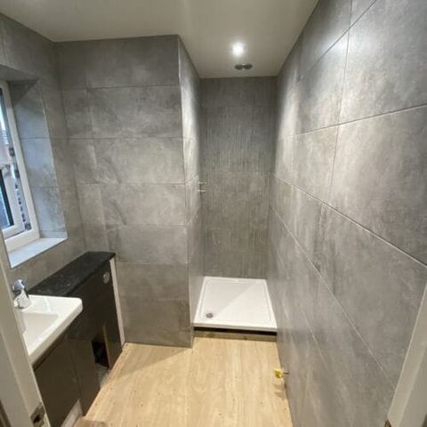 A bright bathroom designed around limited natural light — finished