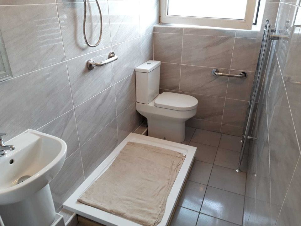 A bathroom installation in an unusually shaped room — work in progress