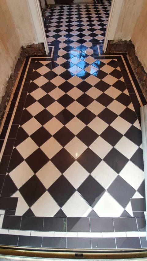Victorian-style floor tiling laid on the diagonal — finished