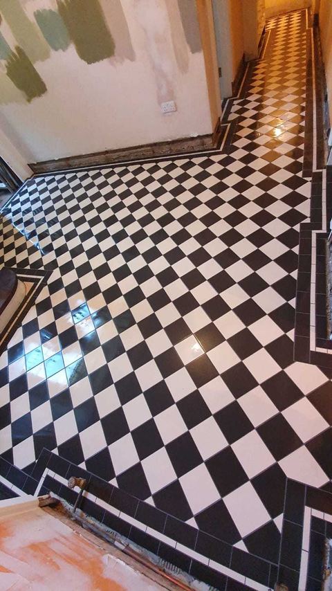 Victorian-style floor tiling laid on the diagonal — finished