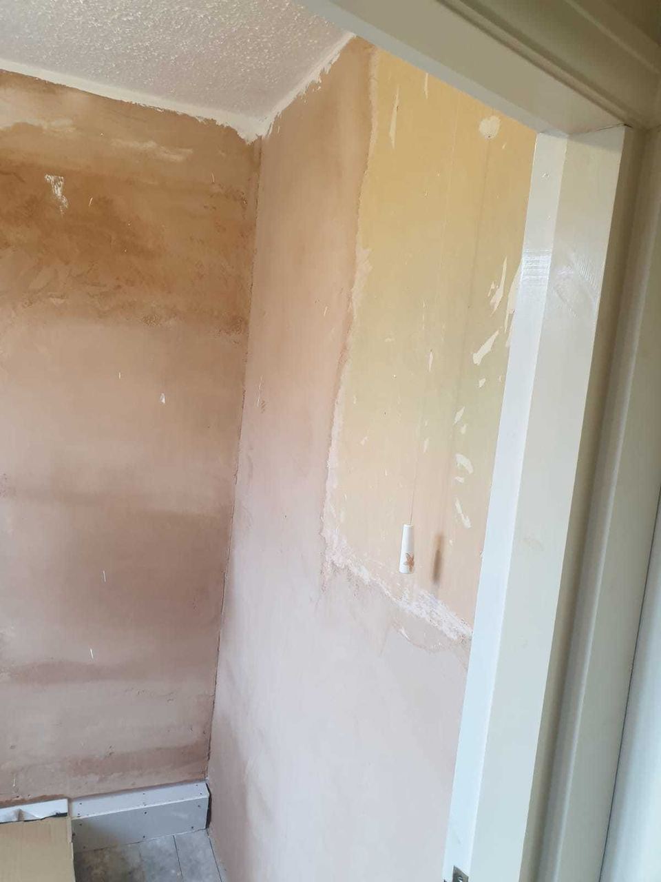 White ceramic tiling to lift a small bathroom — before work started