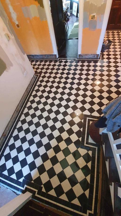 Victorian-style floor tiling laid on the diagonal — finished