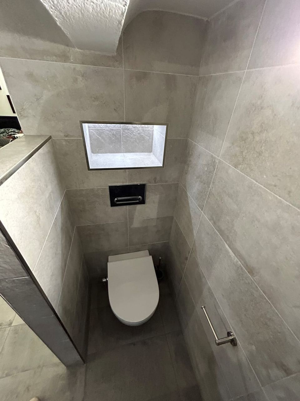 Contemporary apartment bathroom with spa-style storage — finished
