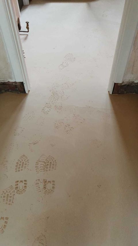 Victorian-style floor tiling laid on the diagonal — finished