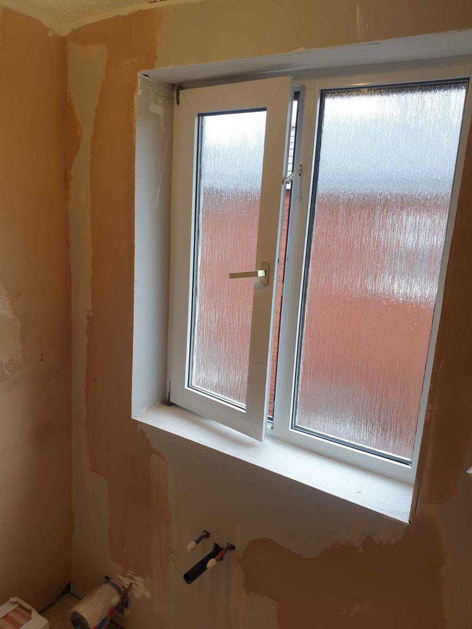 White ceramic tiling to lift a small bathroom — before work started