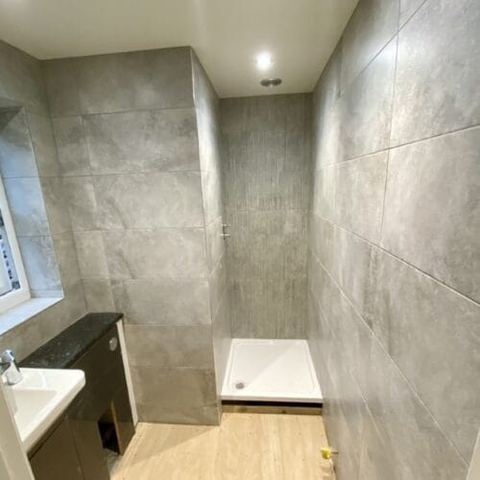 A bright bathroom designed around limited natural light — finished