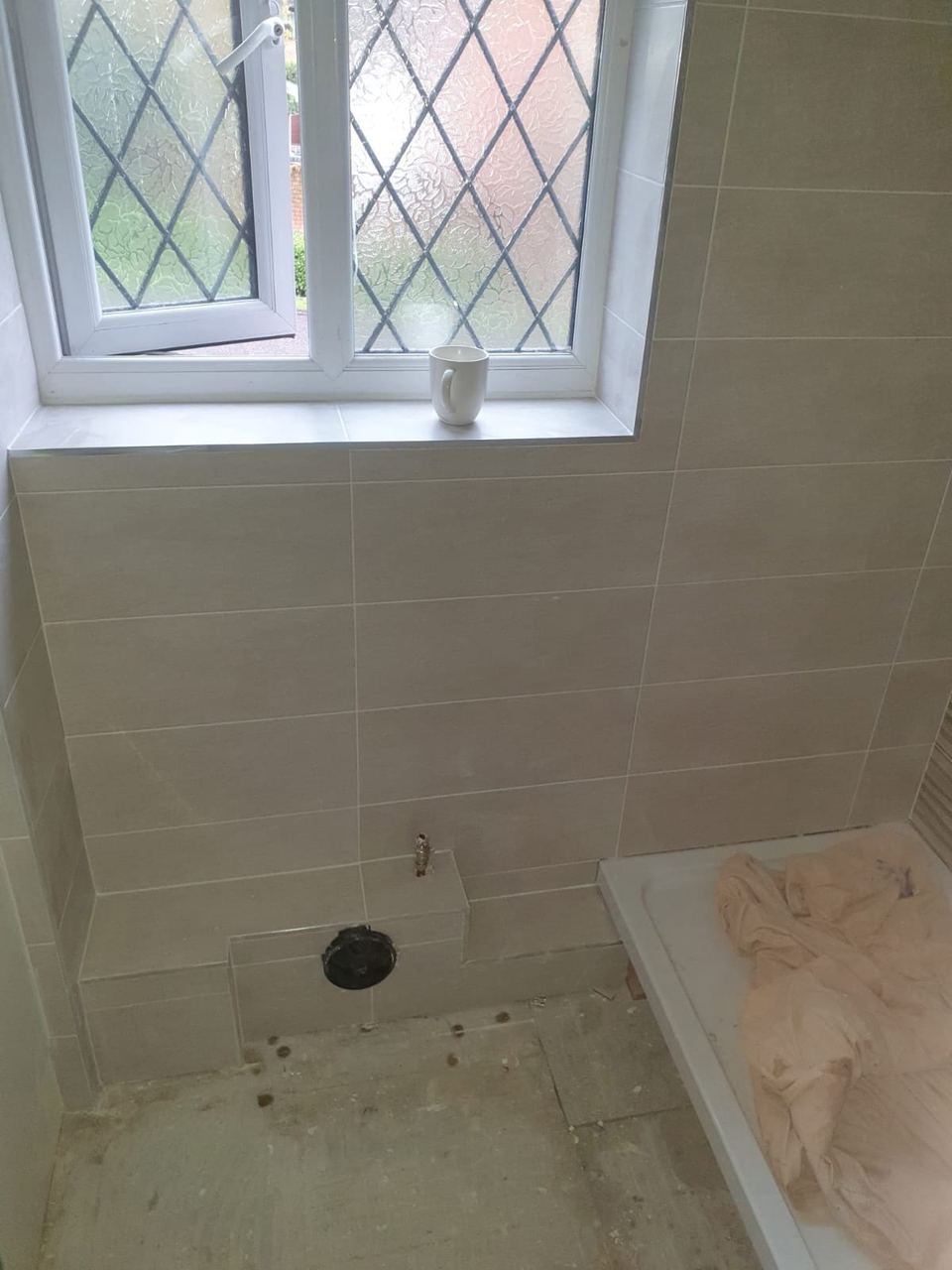 tiling around waste pipe