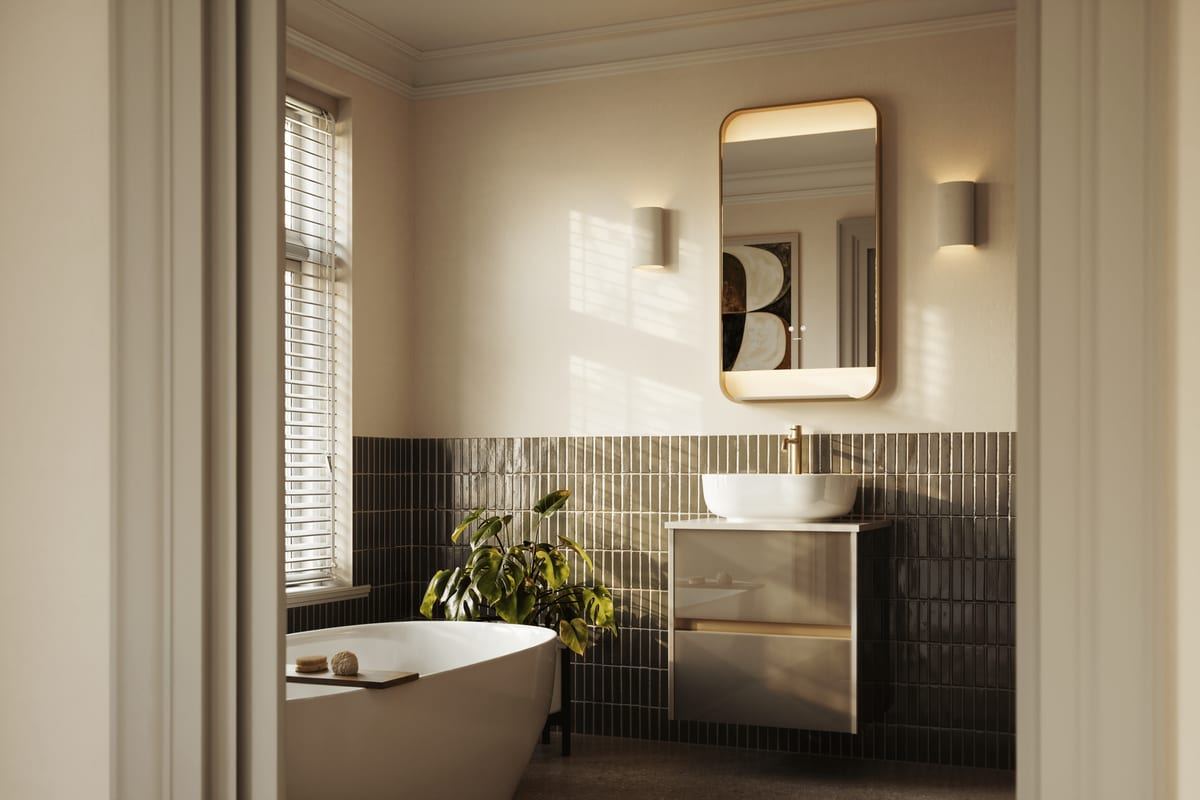 Bowland fitted furniture in Champagne with a freestanding bath and green tiling