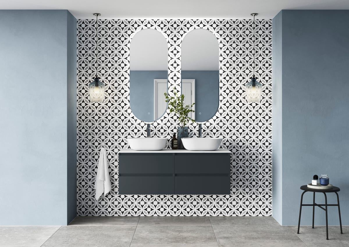 Brenta double vanity in Midnight Cloud with twin oval mirrors and patterned tiling