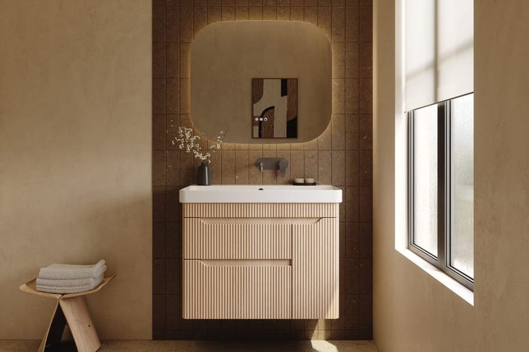 Firova vanity in Tortona Oak below a lit mirror