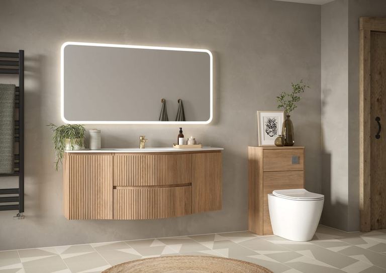 Levanto wave-front vanity in Tortona Oak with a lit mirror