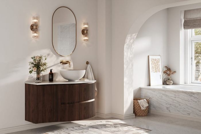 Levanto wave-front vanity in Persian Walnut in an arched bathroom