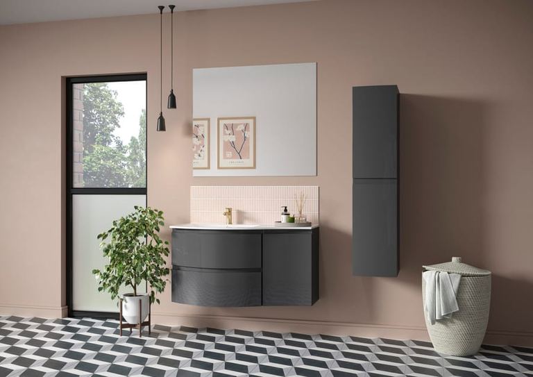 Levanto wave-front vanity in Graphite against a pink wall