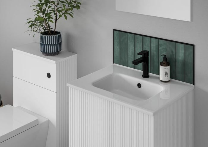 Minori vanity in Opal White with green tiling