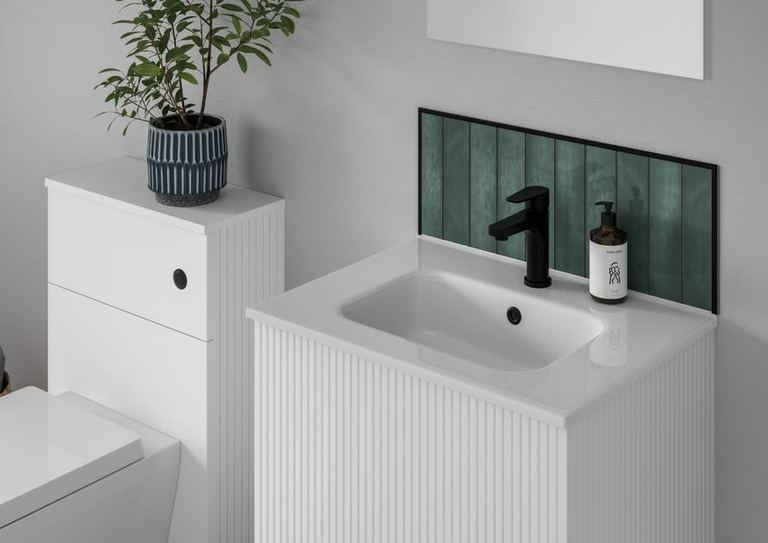 Minori vanity in Opal White with green tiling