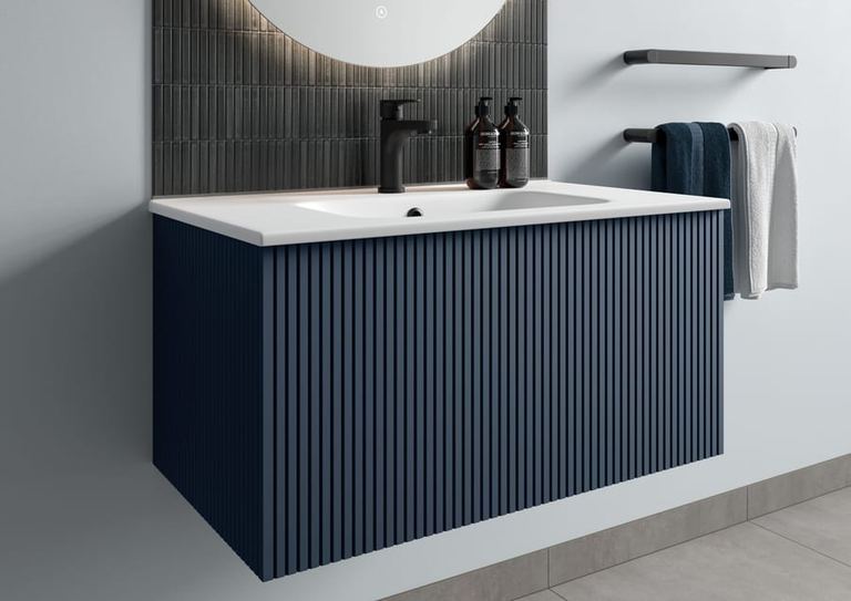 Minori vanity in Admiral Blue below an arched mirror