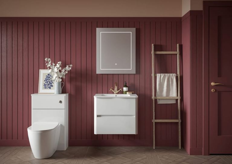 Sora vanity in Pearly White against burgundy panelling