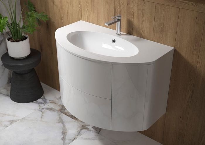 Ultimo curved vanity in Porcelain White with a marble surround