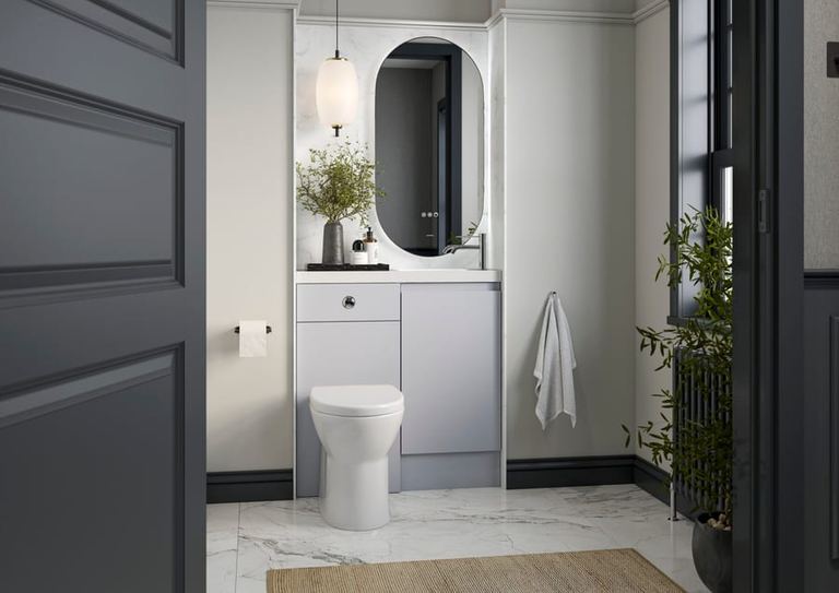 Veneto vanity in Shale with a marble surround