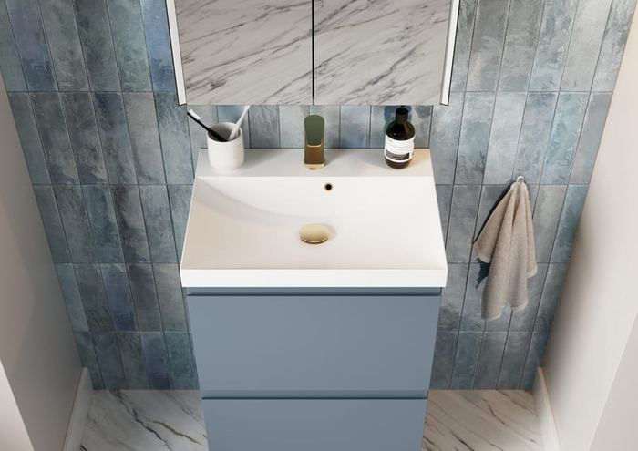 Veneto vanity in Lagoon Mist against blue tiling