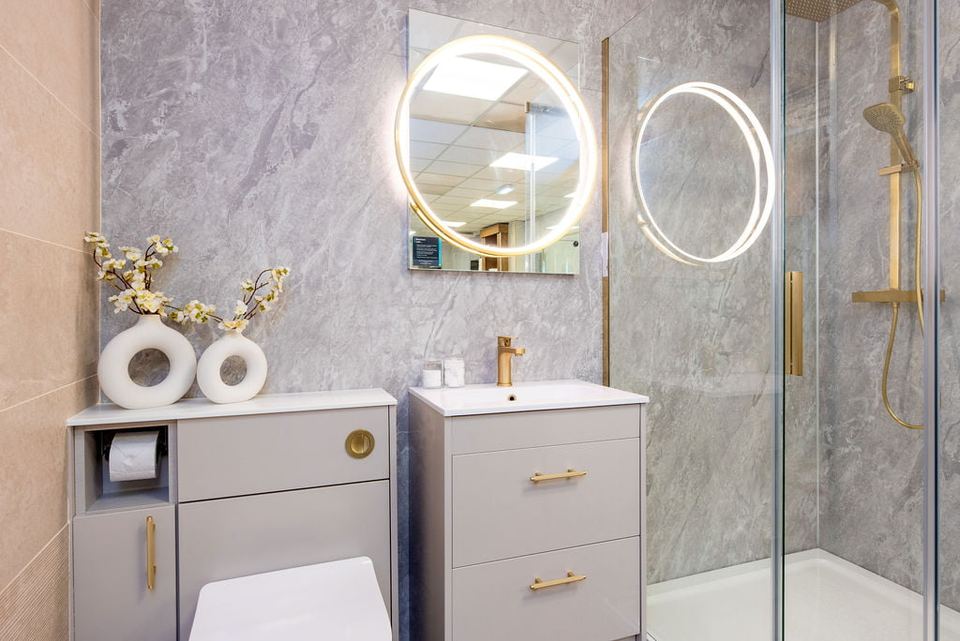 An elegant marble bathroom with a walk-in shower