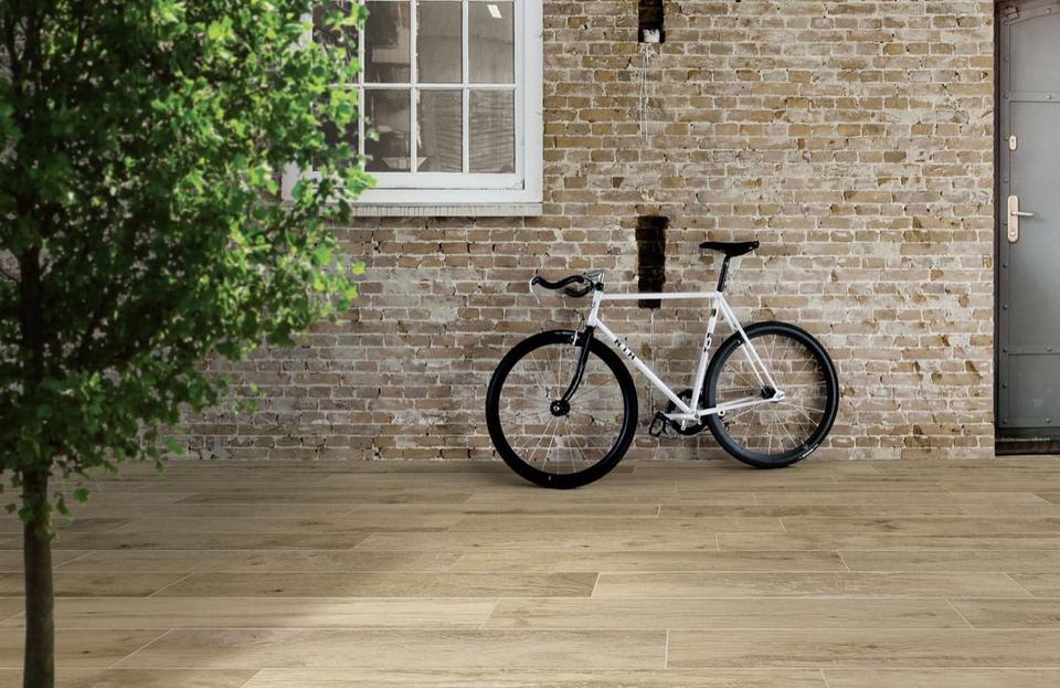 Marazzi Woodmania Honey porcelain tiles fitted in a room, wood-effect, matt