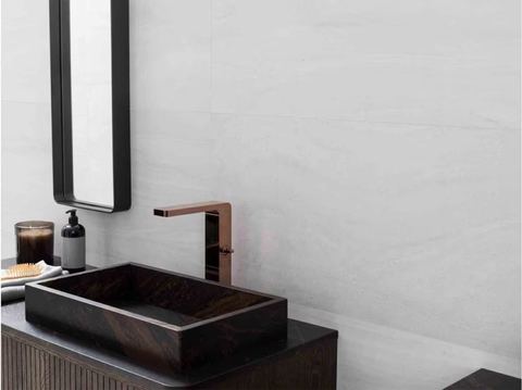 Porcelanosa Butan Bone ceramic tiles fitted in a room, grey, matt