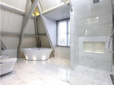 Porcelanosa Carrara Blanco Brillo porcelain tiles fitted in a room, marble-effect, gloss & polished