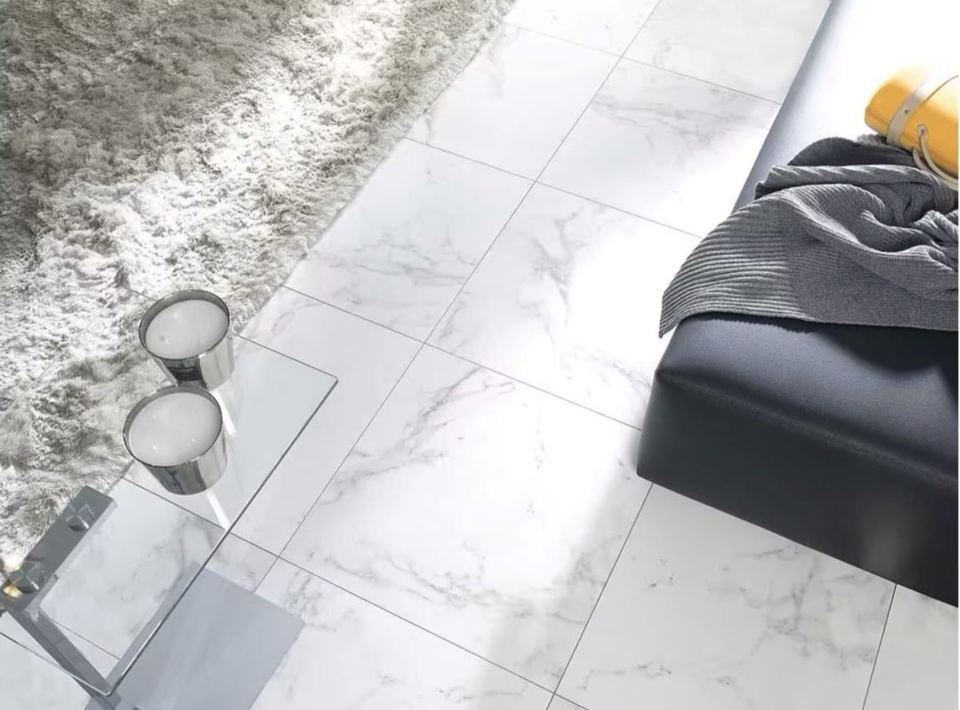 Porcelanosa Carrara Blanco Natural porcelain tiles fitted in a room, marble-effect, matt